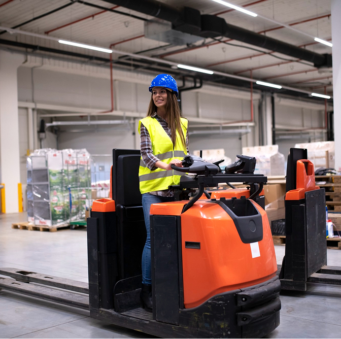 Construction forklift rental equipment on-site lifting materials at a busy job site