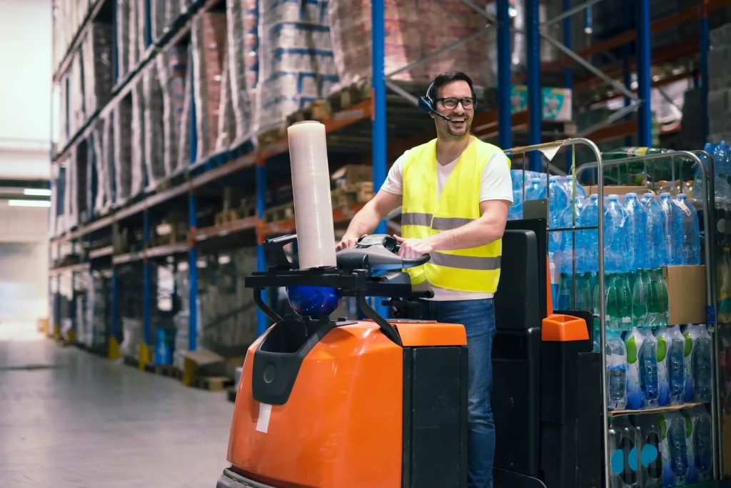 Forklift truck rental with heavy-duty forklift loading pallets at an industrial warehouse dock